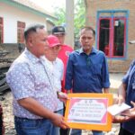 Nanang Ermanto Bantu Korban Rumah Terbakar di Kecamatan Sidomulyo Nanang Ermanto Bantu Korban Rumah Terbakar di Kecamatan Sidomulyo